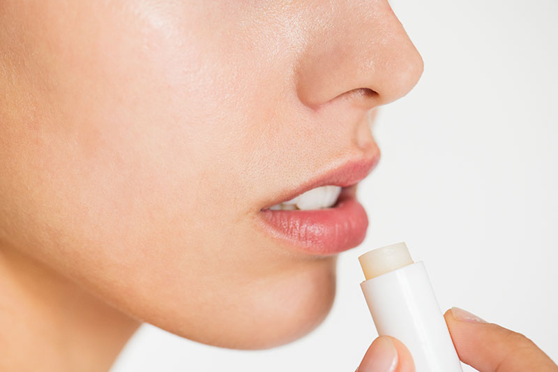 women applying lipcare